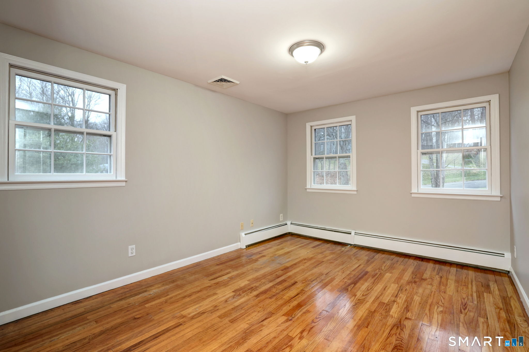 25 Shelter Rock Road Trumbull, CT 06611 - Photo 28 of 37 a view of a room with wooden floor and windows