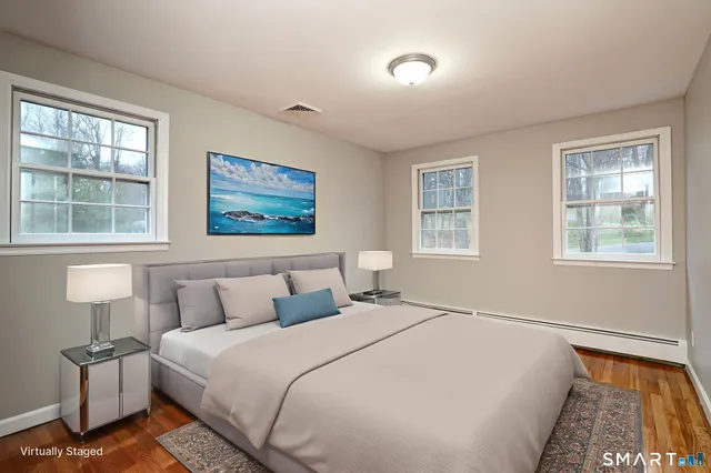 a bedroom with bed and window