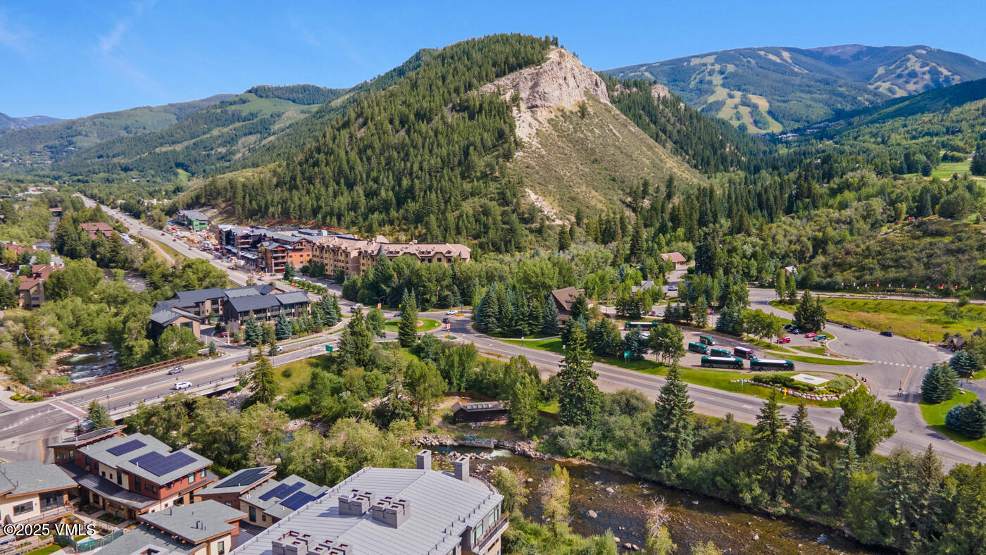 42 Riverfront Lane, Unit 507 Avon, CO 81620 - Photo 23 of 34 a view of a city with mountains in the background