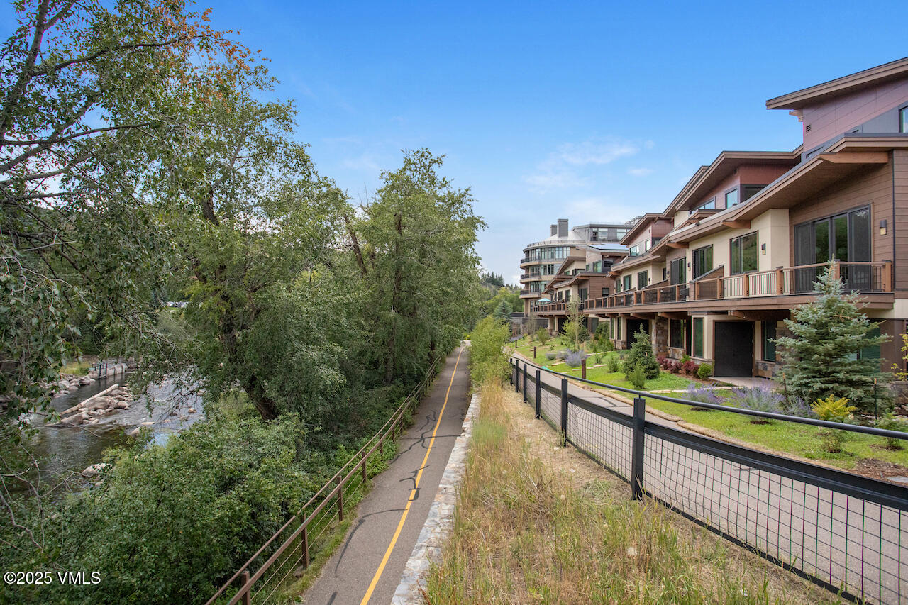 42 Riverfront Lane, Unit 507 Avon, CO 81620 - Photo 25 of 34 a view of house with large windows and a small yard