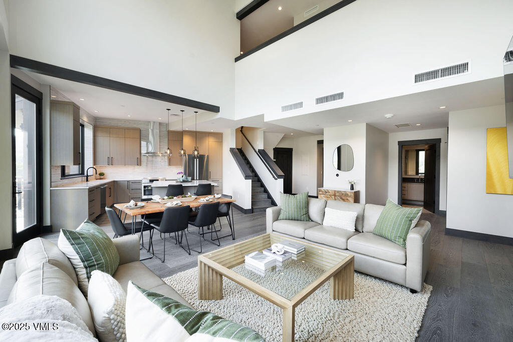 42 Riverfront Lane, Unit 507 Avon, CO 81620 - Photo 3 of 34 a living room with furniture and a wooden floor