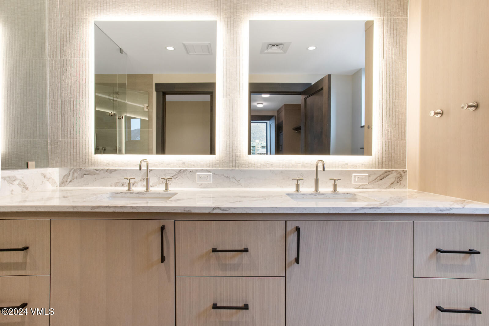 42 Riverfront Lane, Unit 507 Avon, CO 81620 - Photo 6 of 34 a bathroom with a granite countertop sink and a mirror
