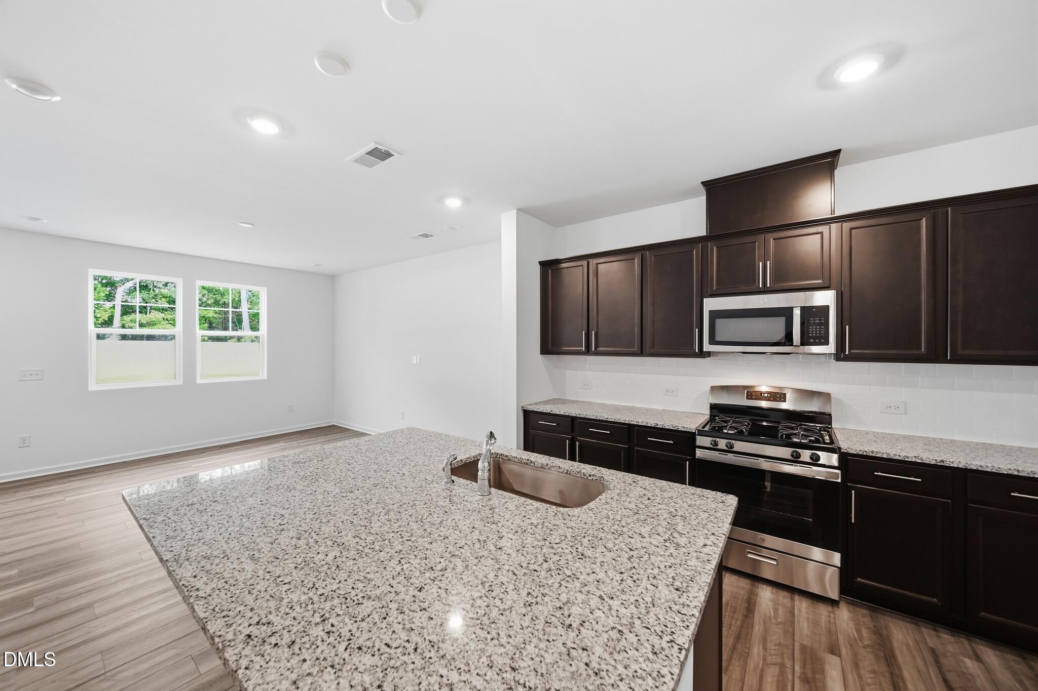 216 Tree Moss Court Rolesville, NC 27571 - Photo 5 of 31 12_216_Tree_Moss_Ct-Kitchen-2074