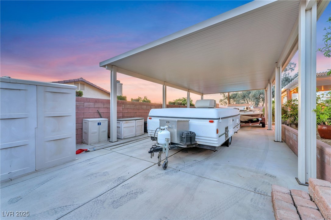 2251 Thoroughbred Road Henderson, NV 89002 - Photo 51 of 60 Parking at dusk with concrete driveway and fence