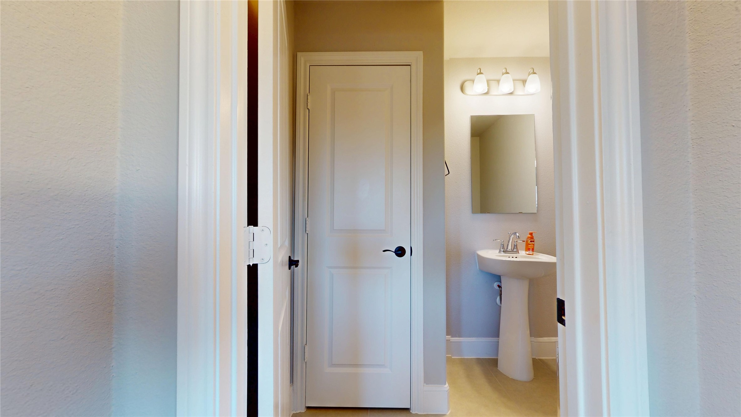 8305 Greenleaf Ridge Way Conroe, TX 77385 - Photo 25 of 33 a bathroom with a sink and mirror