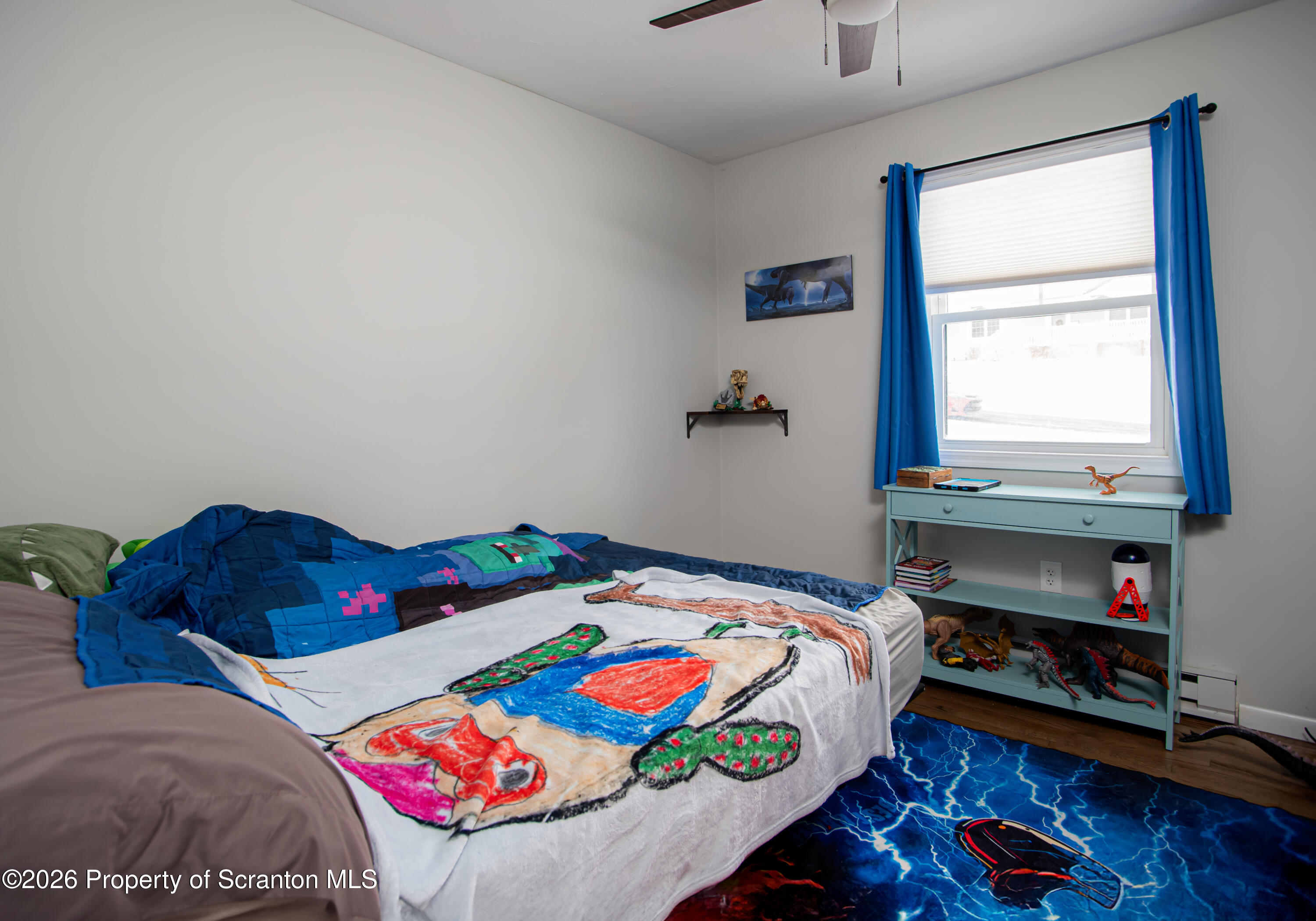 315 Tulip Circle Clarks Summit, PA 18411 - Photo 13 of 30 a bedroom with a bed and a window