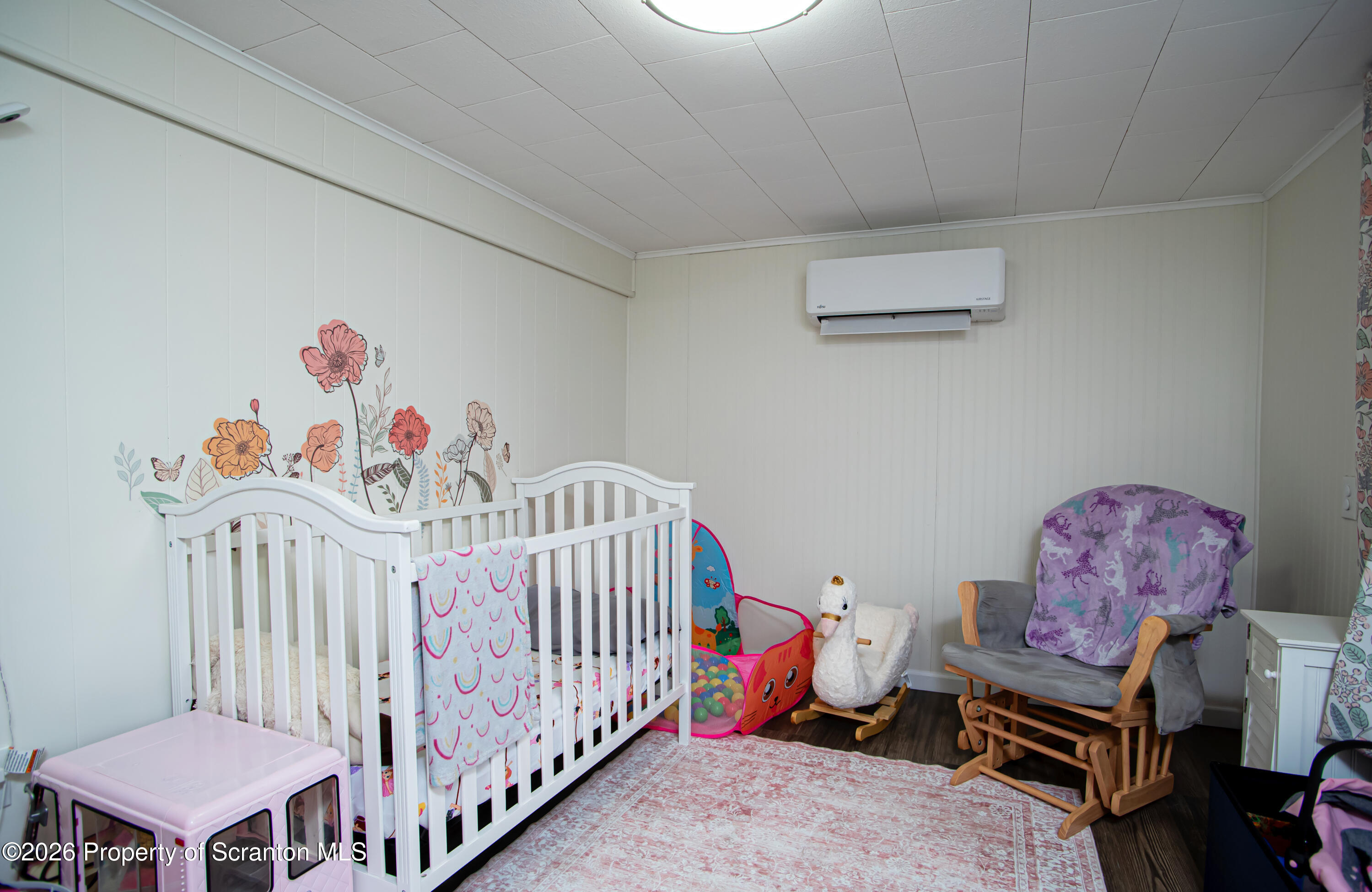 315 Tulip Circle Clarks Summit, PA 18411 - Photo 16 of 30 a bedroom with furniture and a baby crib