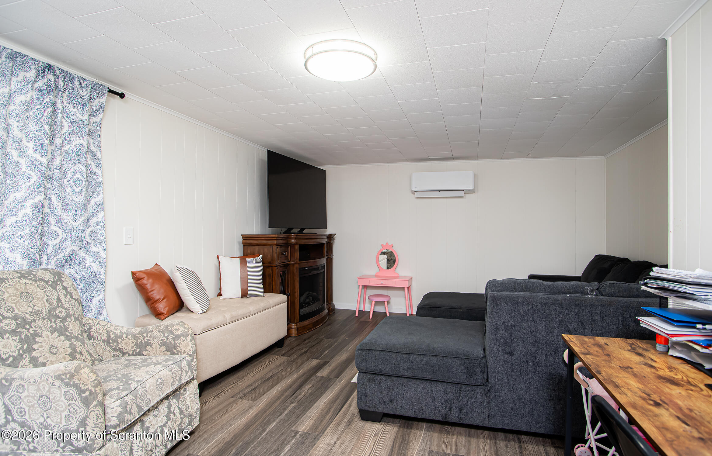 315 Tulip Circle Clarks Summit, PA 18411 - Photo 18 of 30 a living room with furniture and a flat screen tv
