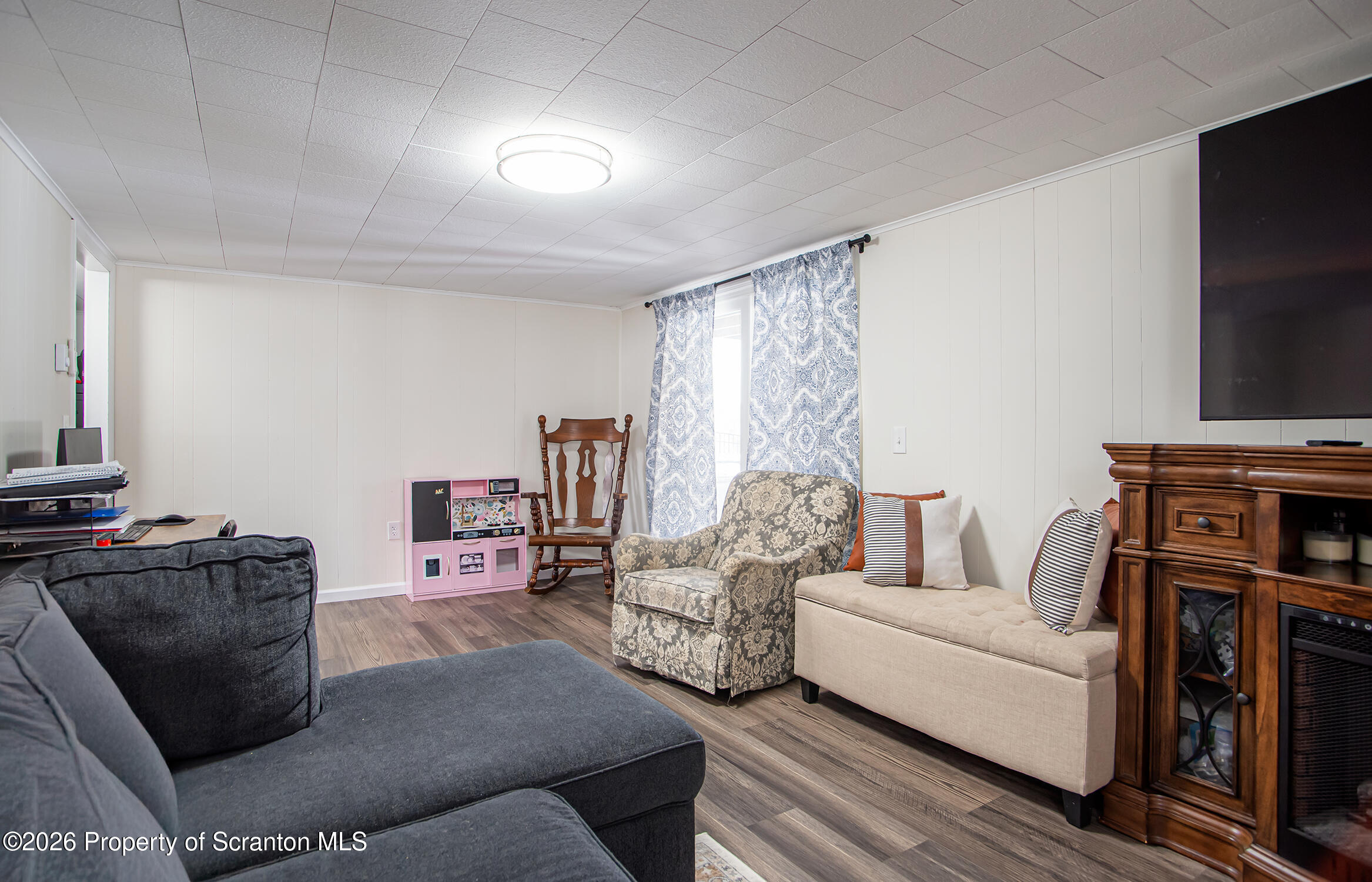 315 Tulip Circle Clarks Summit, PA 18411 - Photo 19 of 30 a living room with furniture and a flat screen tv