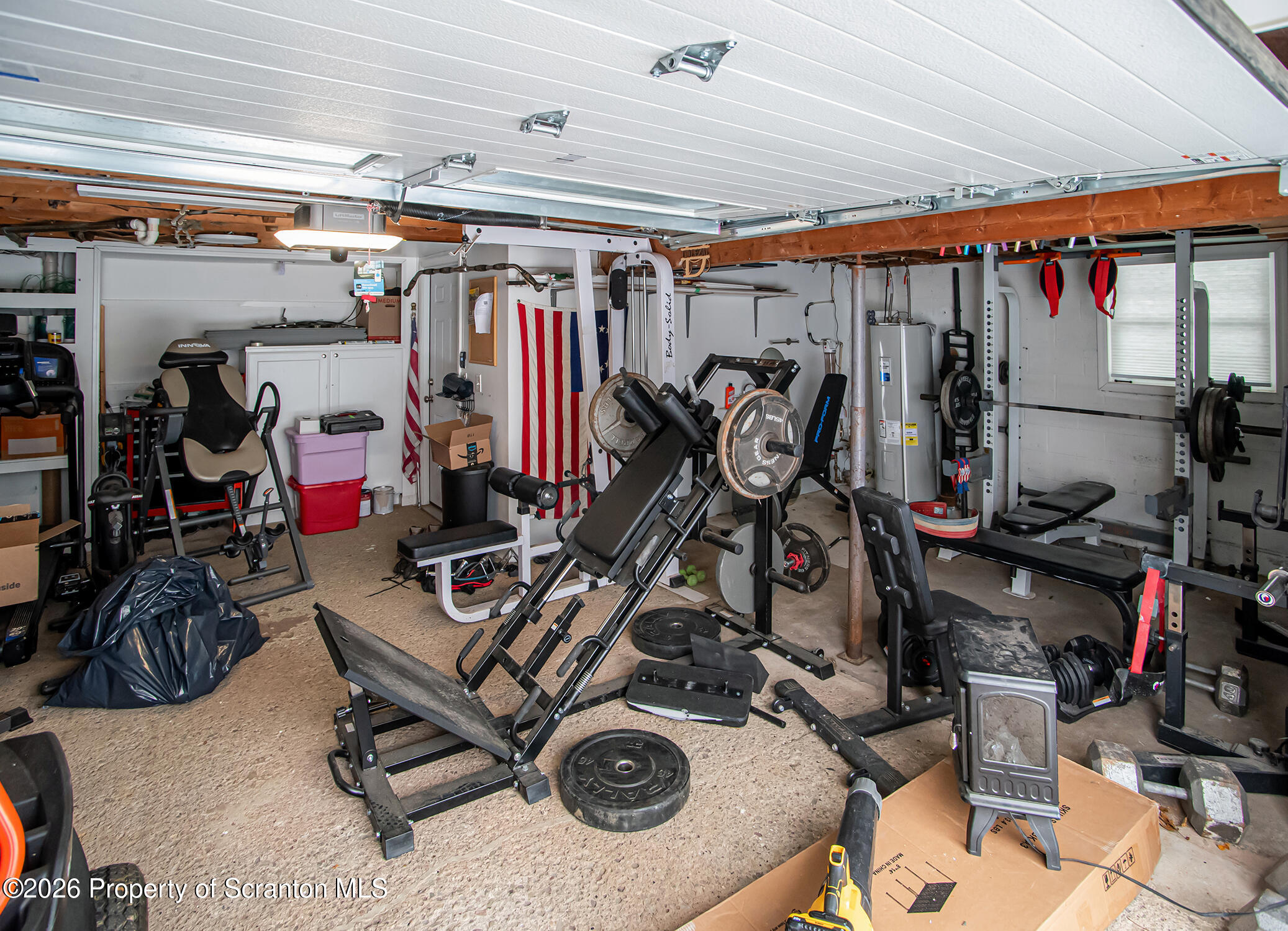 315 Tulip Circle Clarks Summit, PA 18411 - Photo 23 of 30 a view of a storage room with furniture fridge and stairs