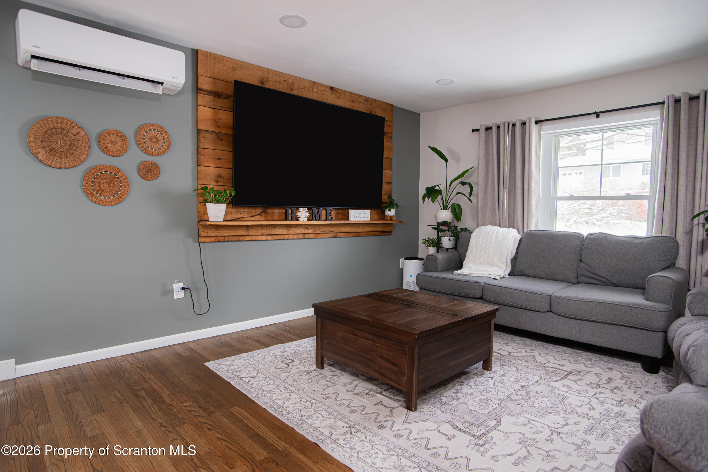 315 Tulip Circle Clarks Summit, PA 18411 - Photo 5 of 30 a living room with furniture and a flat screen tv