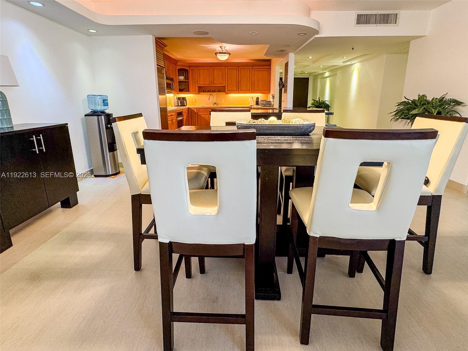 8877 Collins Avenue, Unit 809 Surfside, FL 33154 - Photo 17 of 46 a view of a dining room with furniture