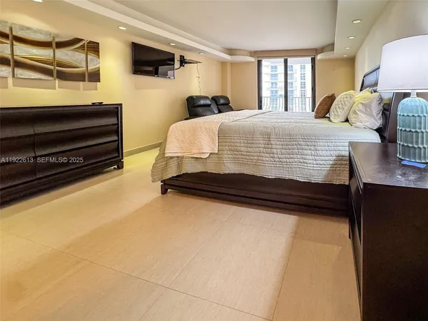 a bedroom with a bed and dresser