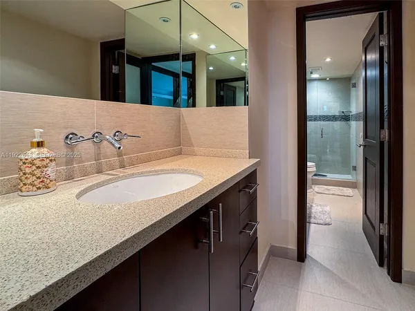 a bathroom with a sink and a mirror