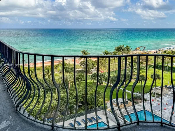 a view of swimming pool from balcony
