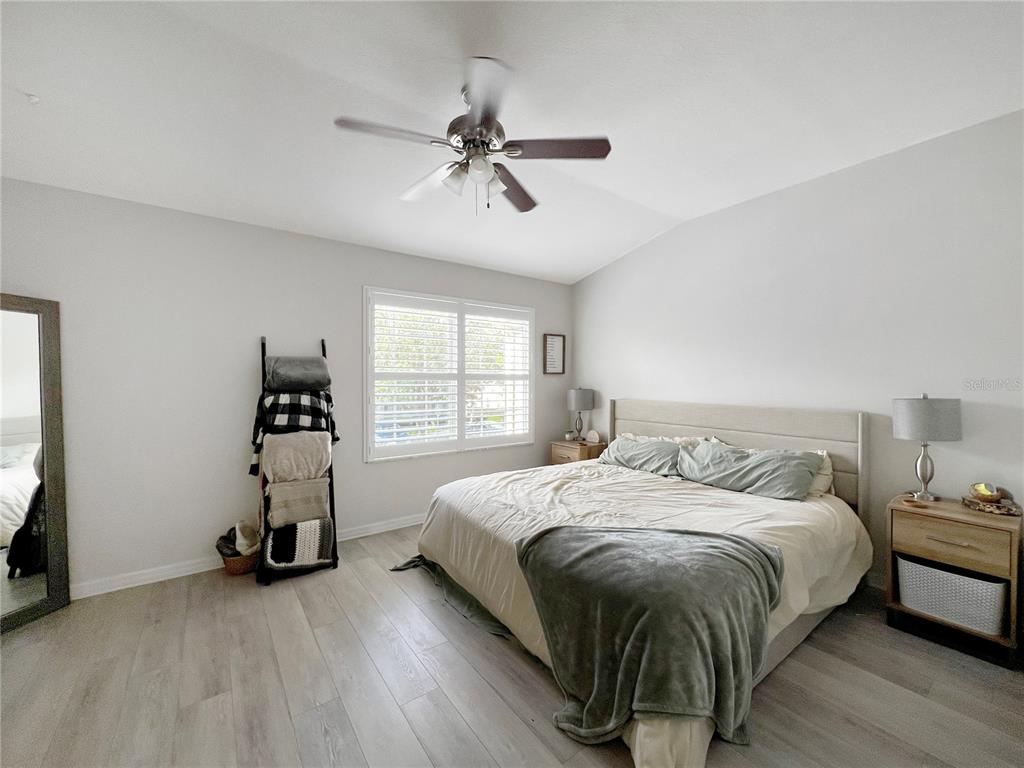 15767 Stable Run Drive Spring Hill, FL 34610 - Photo 21 of 34 a bedroom with a bed and a window
