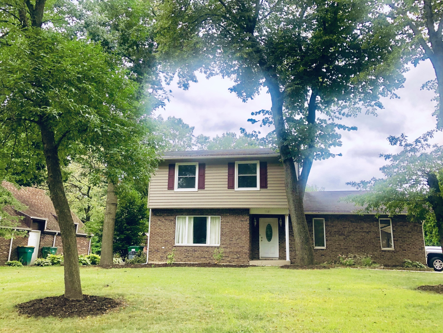a front view of a house with garden