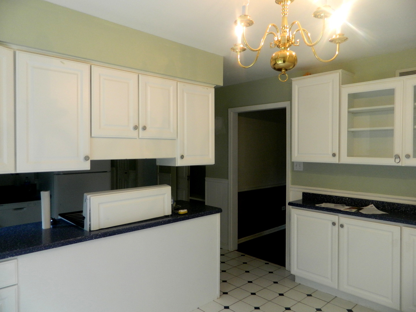 1101 South Raven Road Shorewood, IL 60404 - Photo 12 of 24 a kitchen with a refrigerator and cabinets