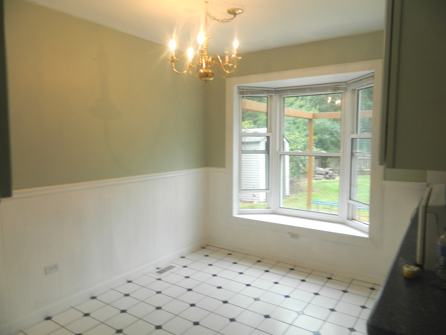 1101 South Raven Road Shorewood, IL 60404 - Photo 13 of 24 a view of wooden floor and chandelier in a room