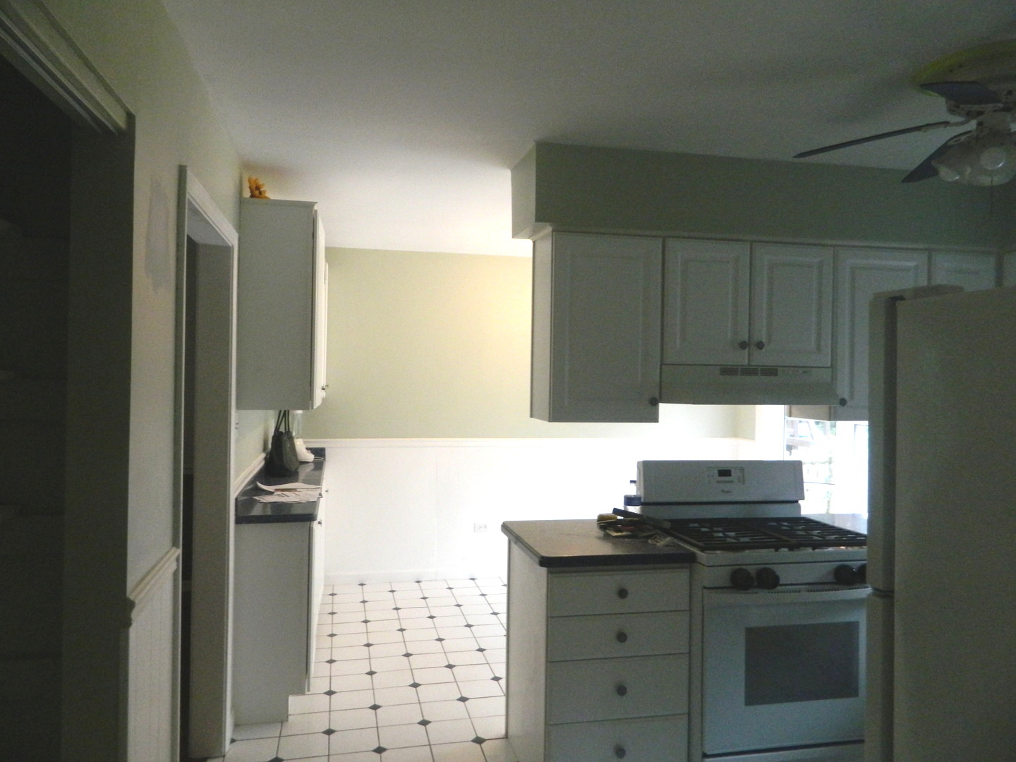 1101 South Raven Road Shorewood, IL 60404 - Photo 14 of 24 a kitchen with granite countertop a stove and a refrigerator