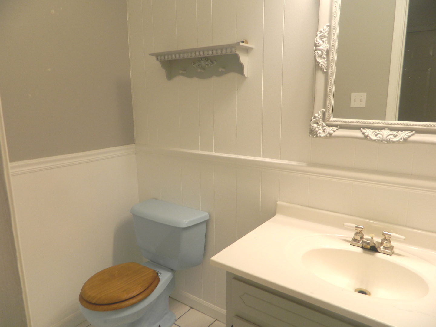 1101 South Raven Road Shorewood, IL 60404 - Photo 16 of 24 a bathroom with a sink a toilet and a mirror