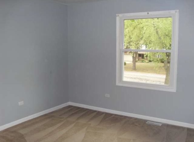 1101 South Raven Road Shorewood, IL 60404 - Photo 18 of 24 an empty room with a window