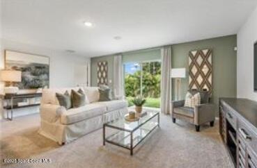 952 Roseland Road Sebastian, FL 32958 - Photo 2 of 5 a living room with furniture and a potted plant