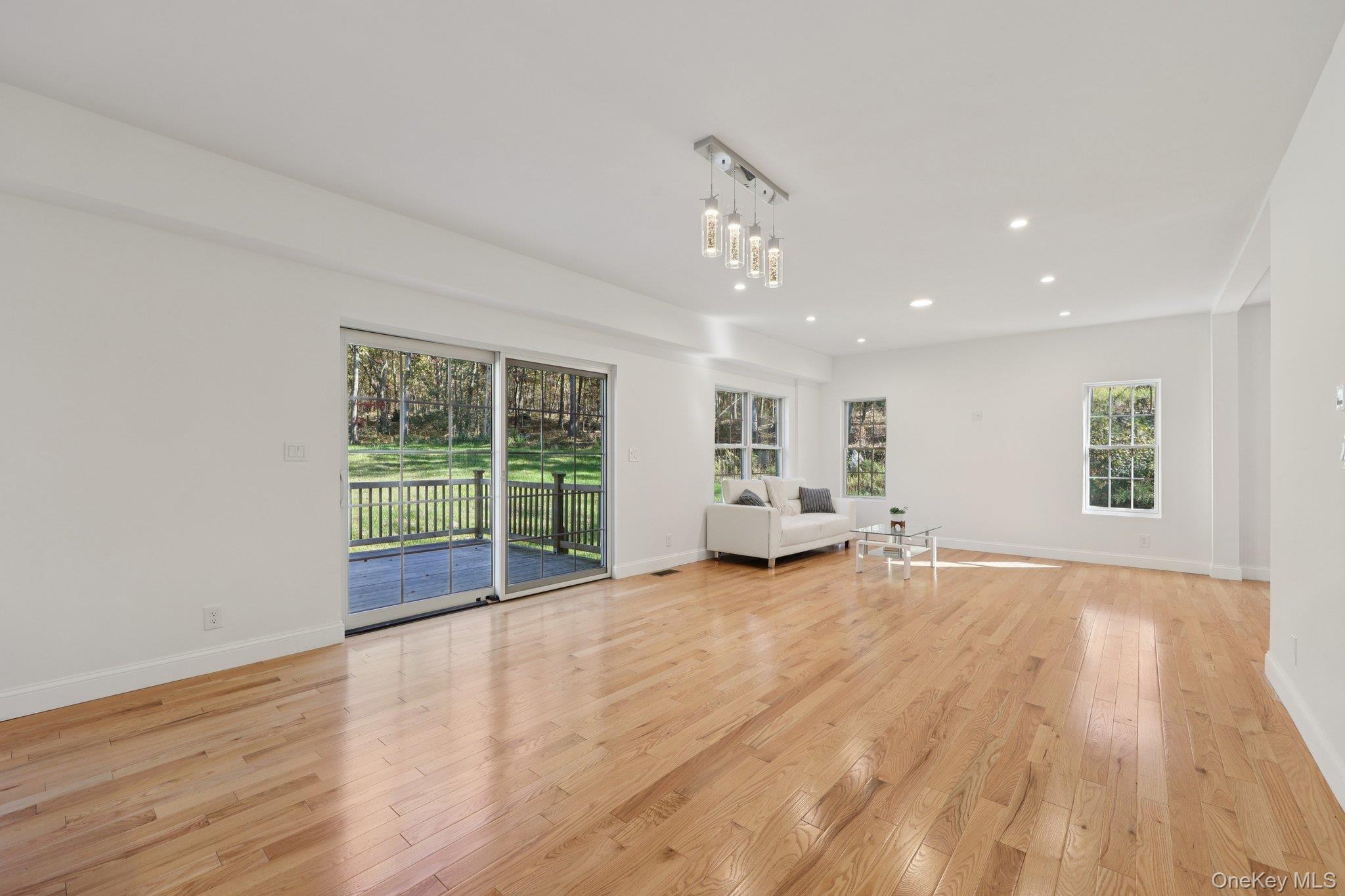 27 Oak Hill Road Monroe, NY 10950 - Photo 13 of 48 a view of an empty room with wooden floor and a window