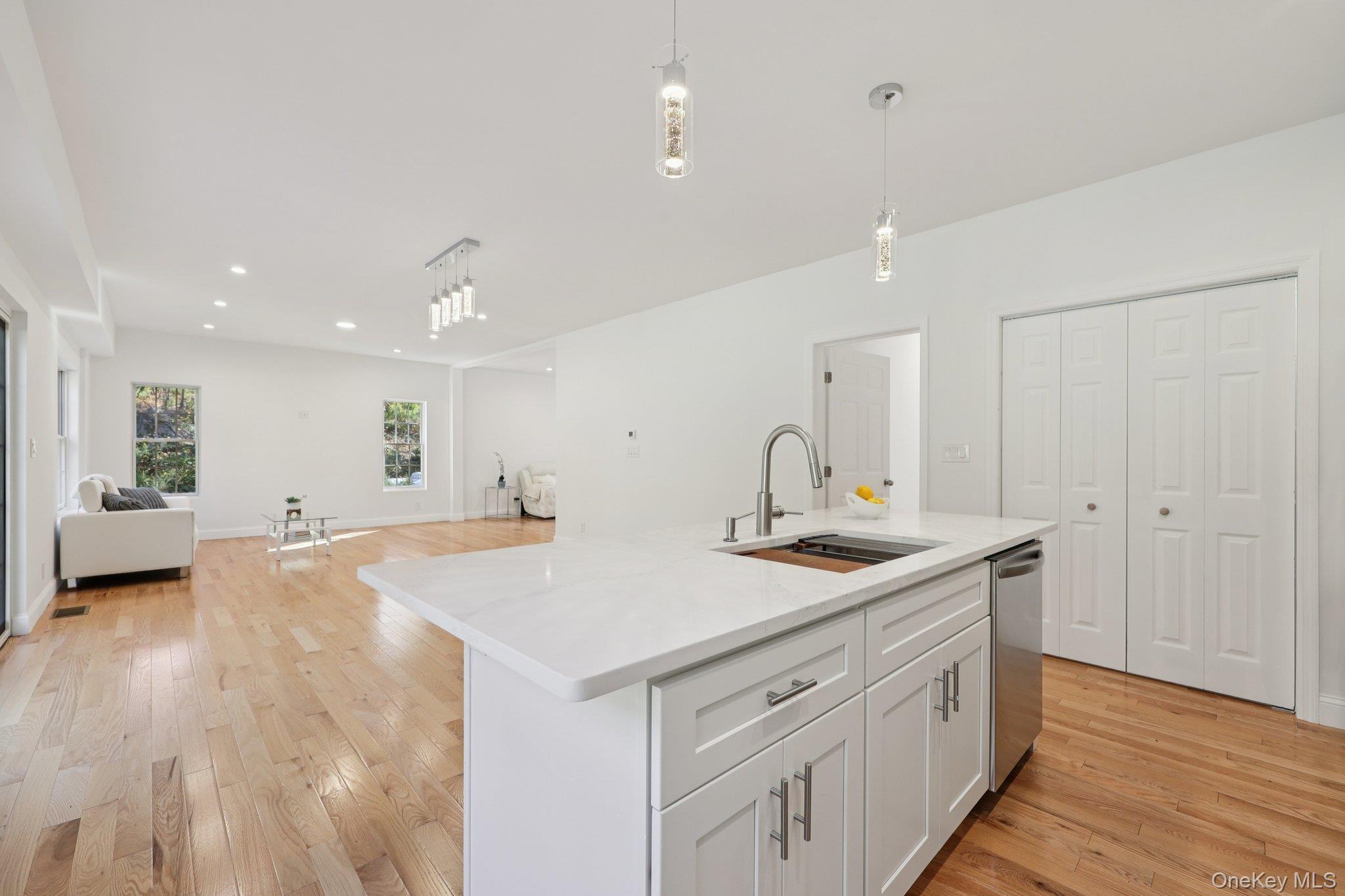 27 Oak Hill Road Monroe, NY 10950 - Photo 47 of 48 a view of a kitchen counter top space with sink and mirror