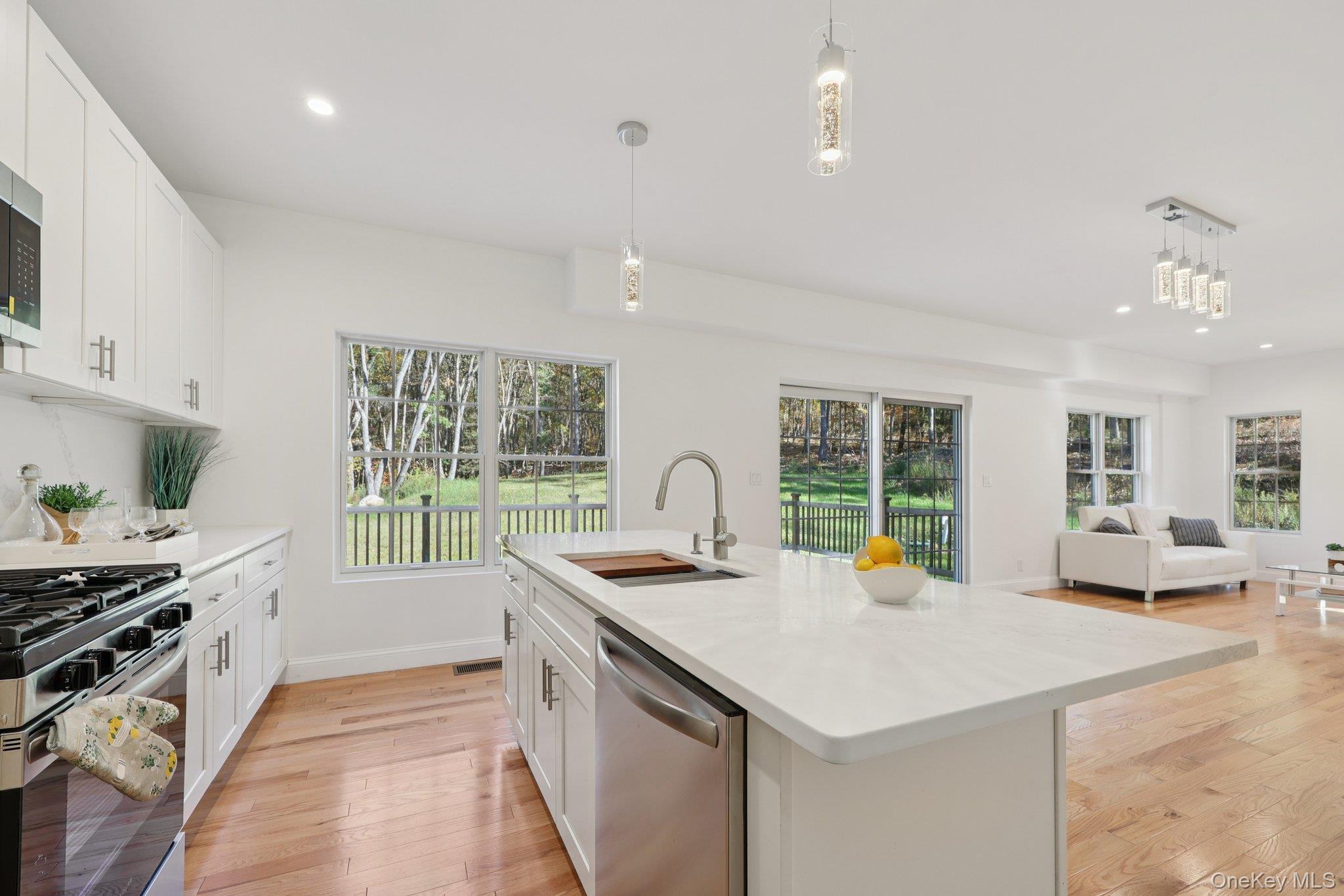 27 Oak Hill Road Monroe, NY 10950 - Photo 48 of 48 a kitchen with a stove a sink and a refrigerator