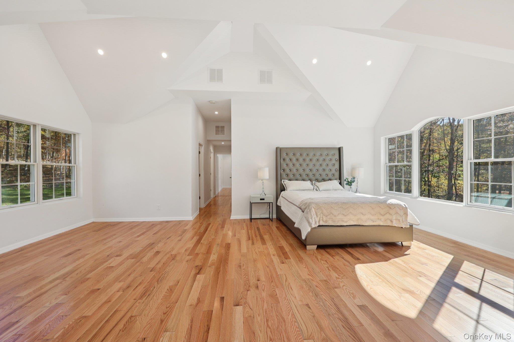 27 Oak Hill Road Monroe, NY 10950 - Photo 32 of 48 a spacious bedroom with a bed and wooden floor