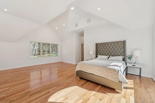 a view of a room with wooden floor and fence