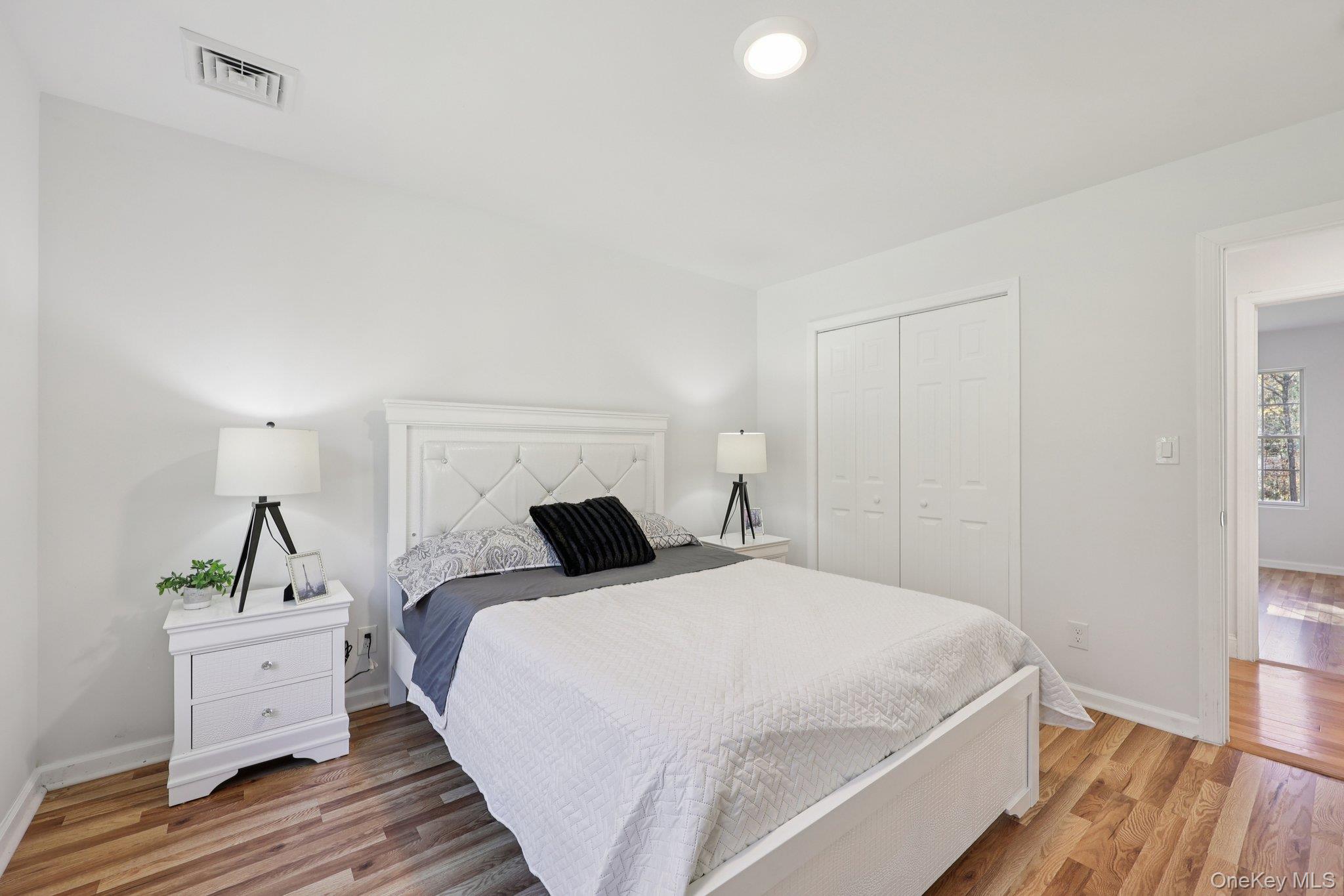 27 Oak Hill Road Monroe, NY 10950 - Photo 36 of 48 a bedroom with a bed and a potted plant