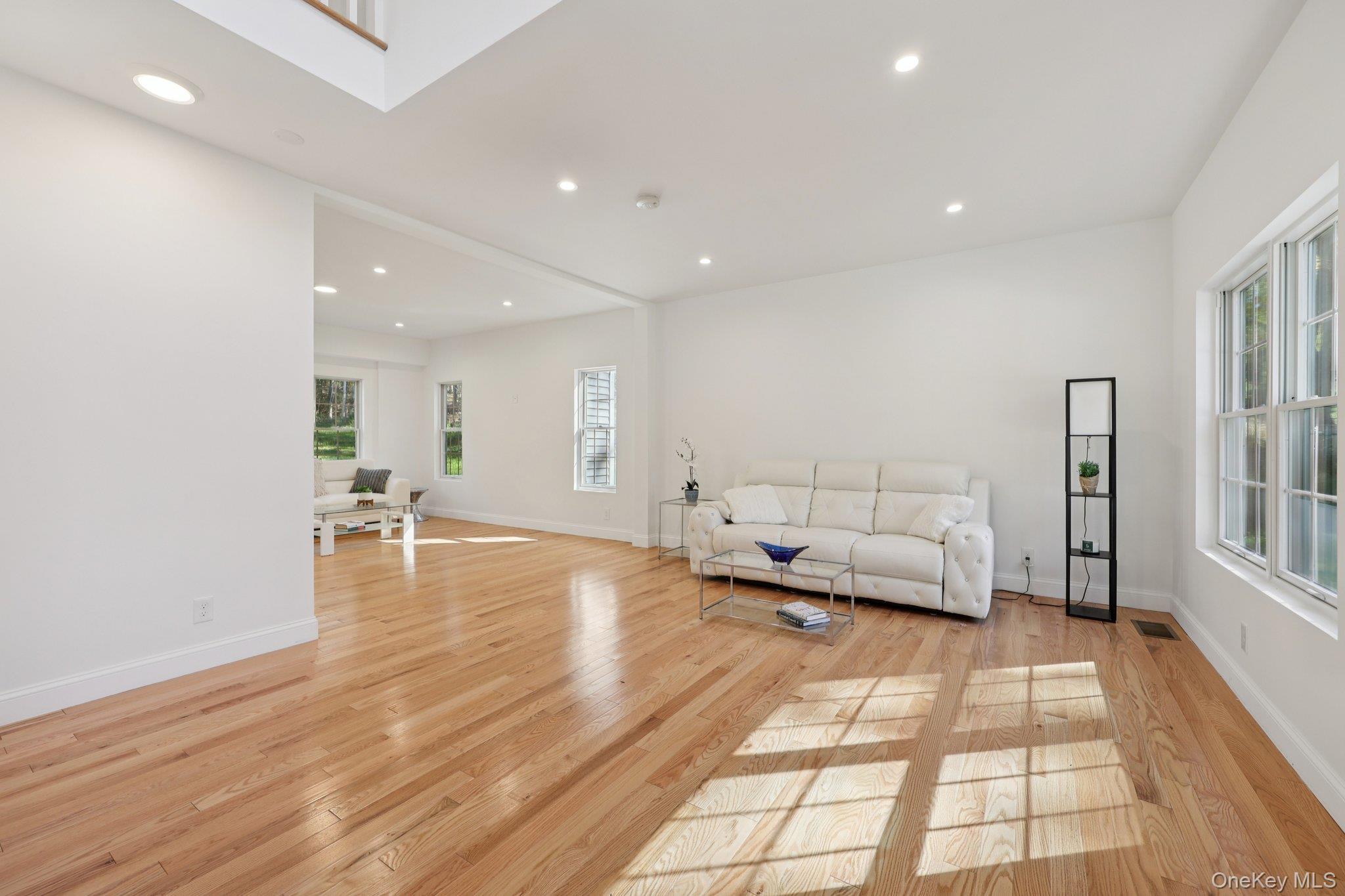 27 Oak Hill Road Monroe, NY 10950 - Photo 4 of 48 a living room with furniture and a table with wooden floor
