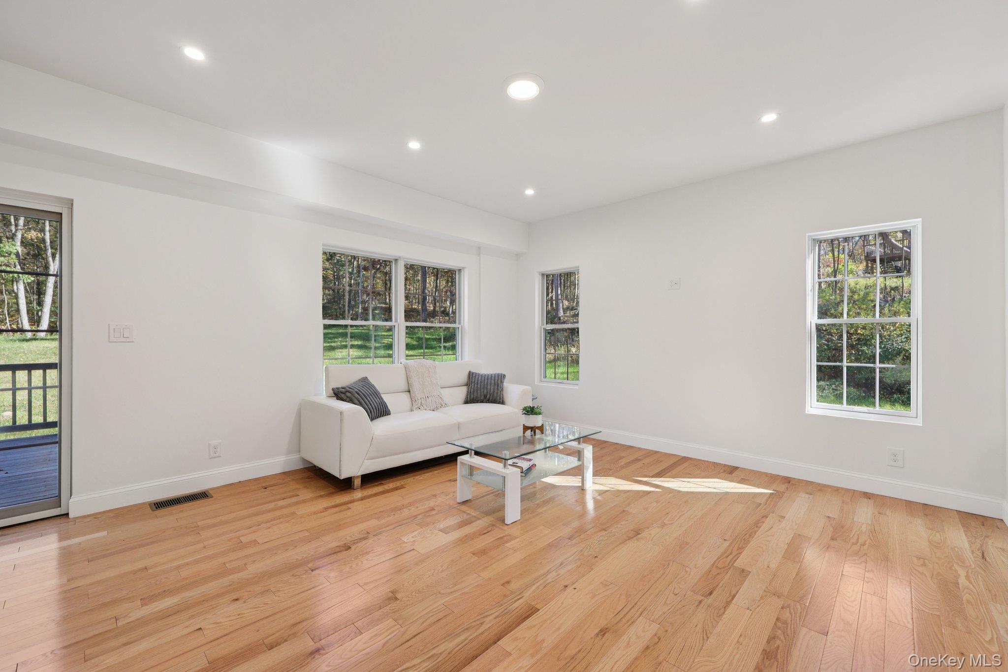 27 Oak Hill Road Monroe, NY 10950 - Photo 9 of 48 a living room with furniture and a large window