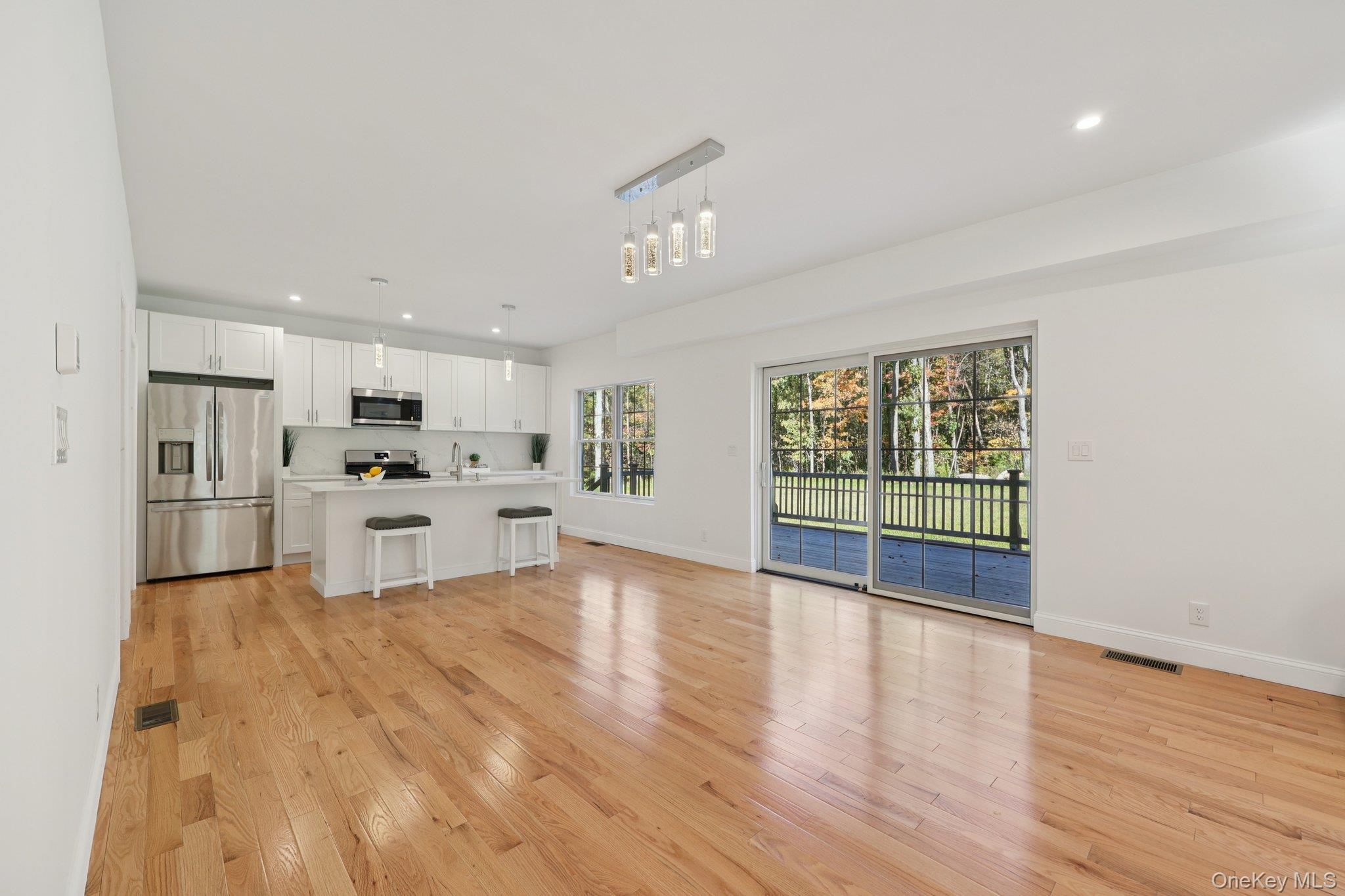 27 Oak Hill Road Monroe, NY 10950 - Photo 10 of 48 a view of kitchen with wooden floor and window