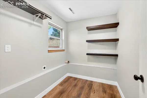 a view of an empty room with a window