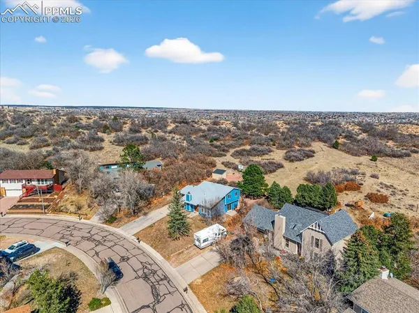 an aerial view of a house with a ocean view