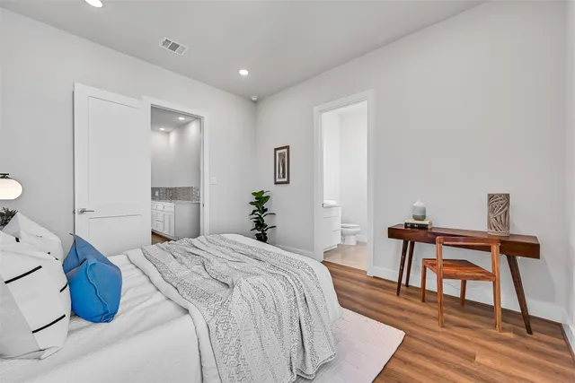 a bedroom with a bed and a table in it