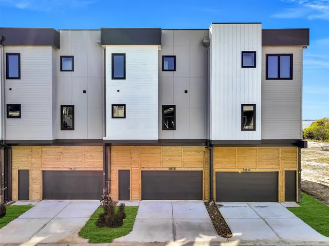 a front view of a building with glass windows