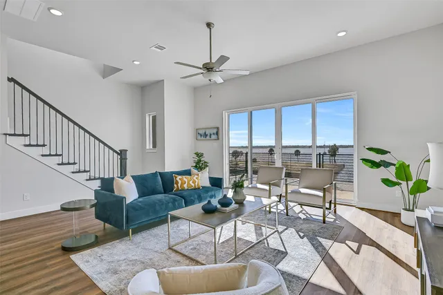 a living room with furniture and a potted plant