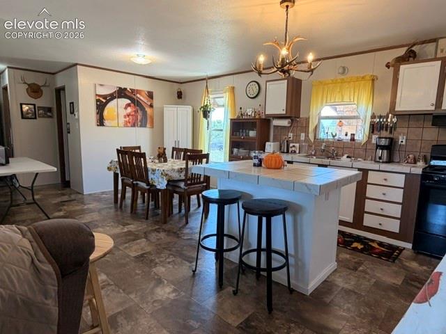 8084 Oak Drive Rye, CO 81069 - Photo 8 of 39 Kitchen island, Pantry Cabinet and newer appliances!