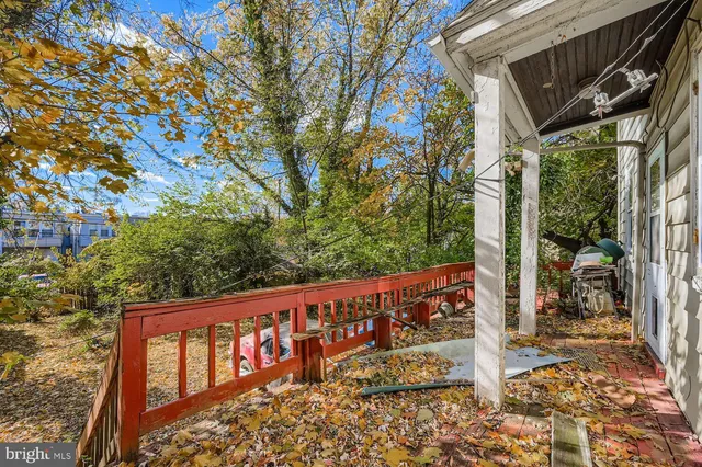 a wooden fence with street sign