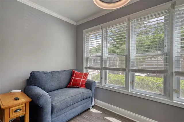 a living room with furniture and a window