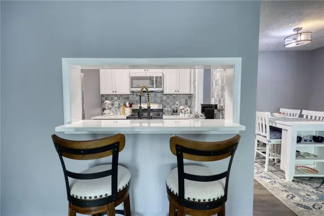 a kitchen with a table and chairs