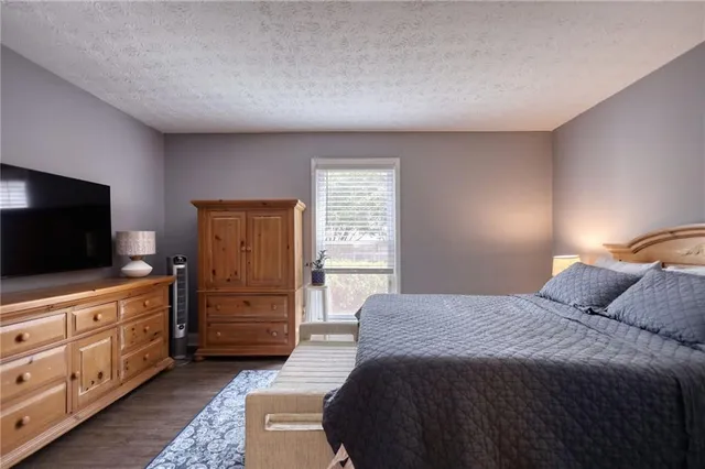 a bedroom with a bed and furniture