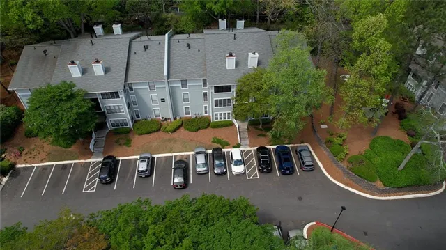 an aerial view of a house with outdoor space patio and lake view
