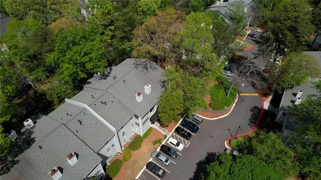 an aerial view of a house with swimming pool and outdoor space