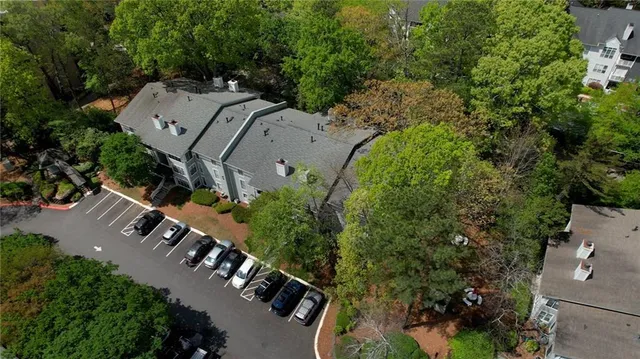 an aerial view of a house with outdoor space and street view
