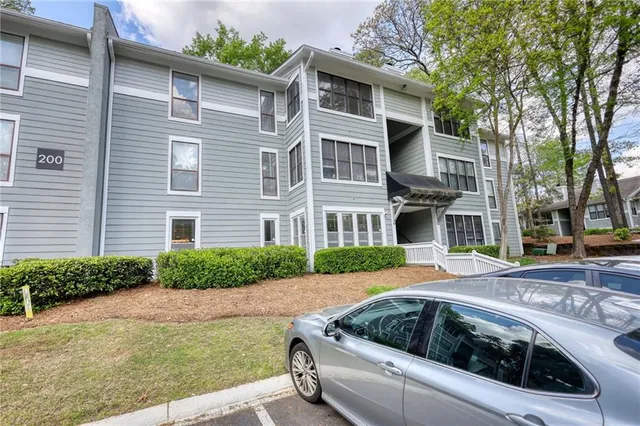 a view of multiple house with a yard